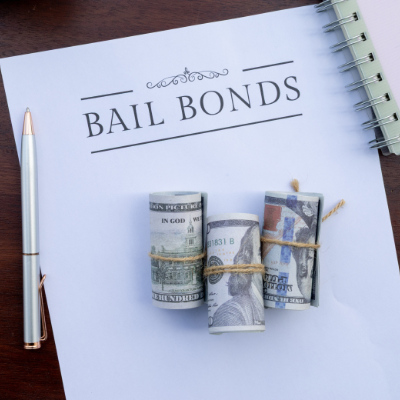 Paperwork representing bail bond agreements in a courtroom context