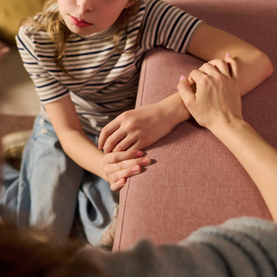 Caregiver reassuring a worried child